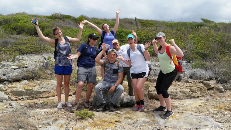 Education abroad students on a rocky hillside in Puerto Rico