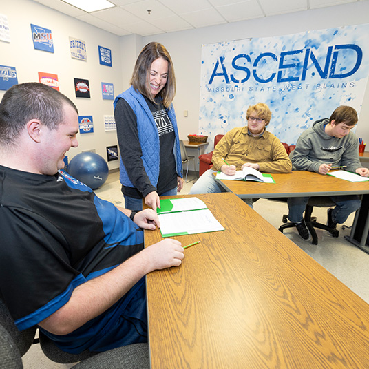 ASCEND students working with the program coordinator