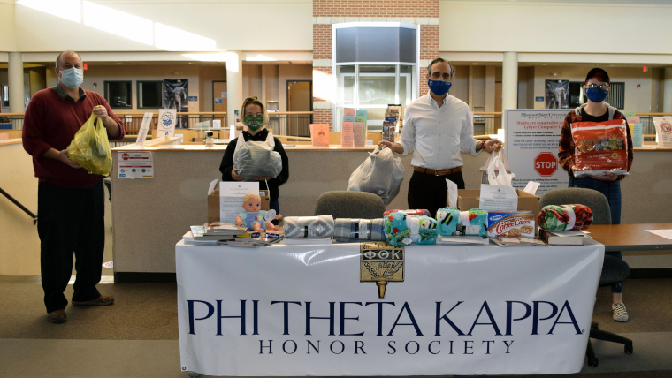 Students and faculty in Lybyer at their donation table