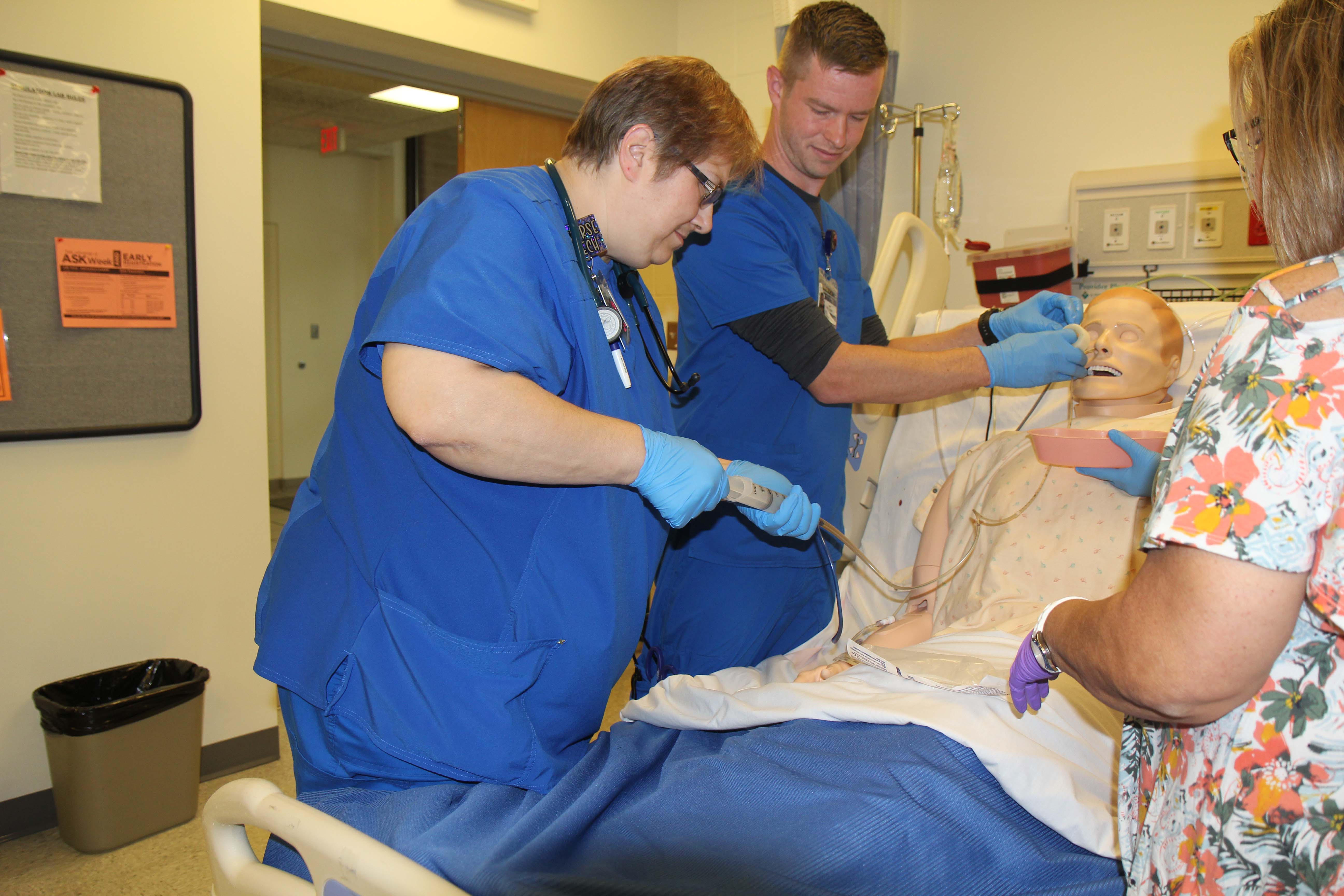 Nursing students giving fluids