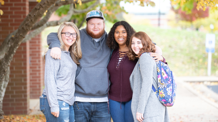 4 smiling students