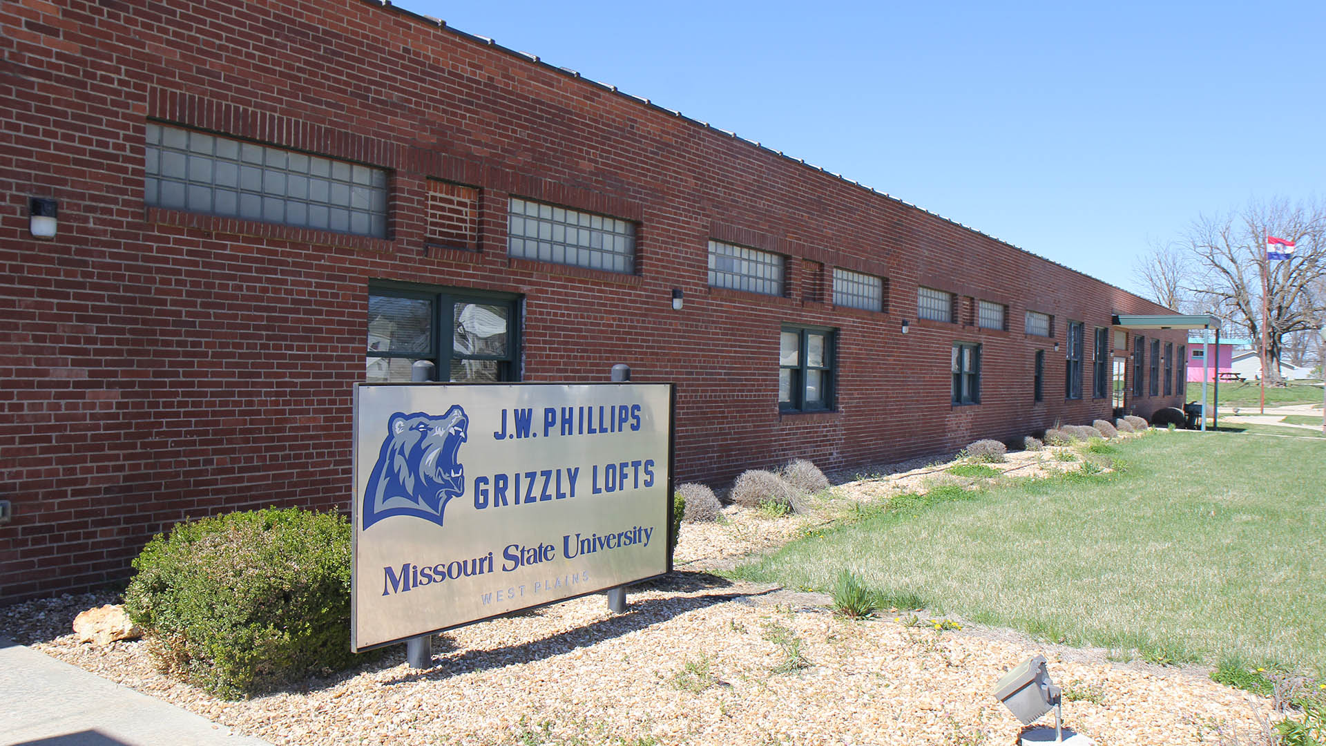 Front of the Grizzly Lofts with a new sign