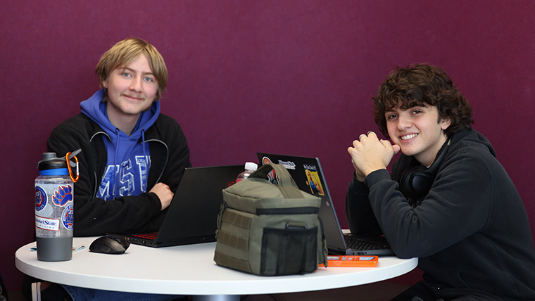 two guys studying in Hass-Darr Student Union