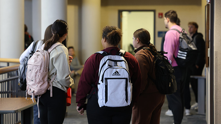 students with backpacks in Lybyer Hall