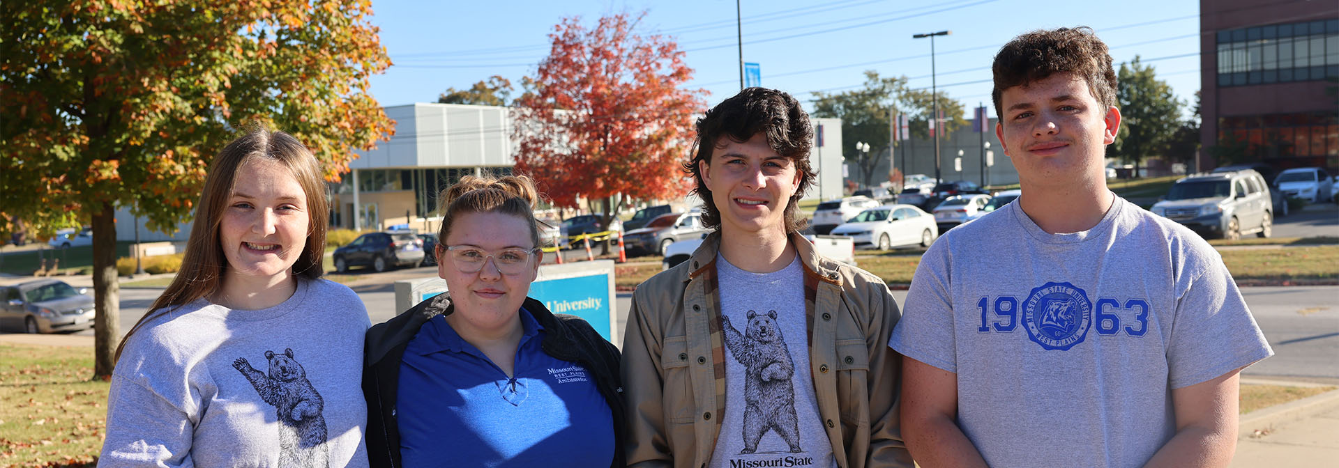 Four ambassadors smiling