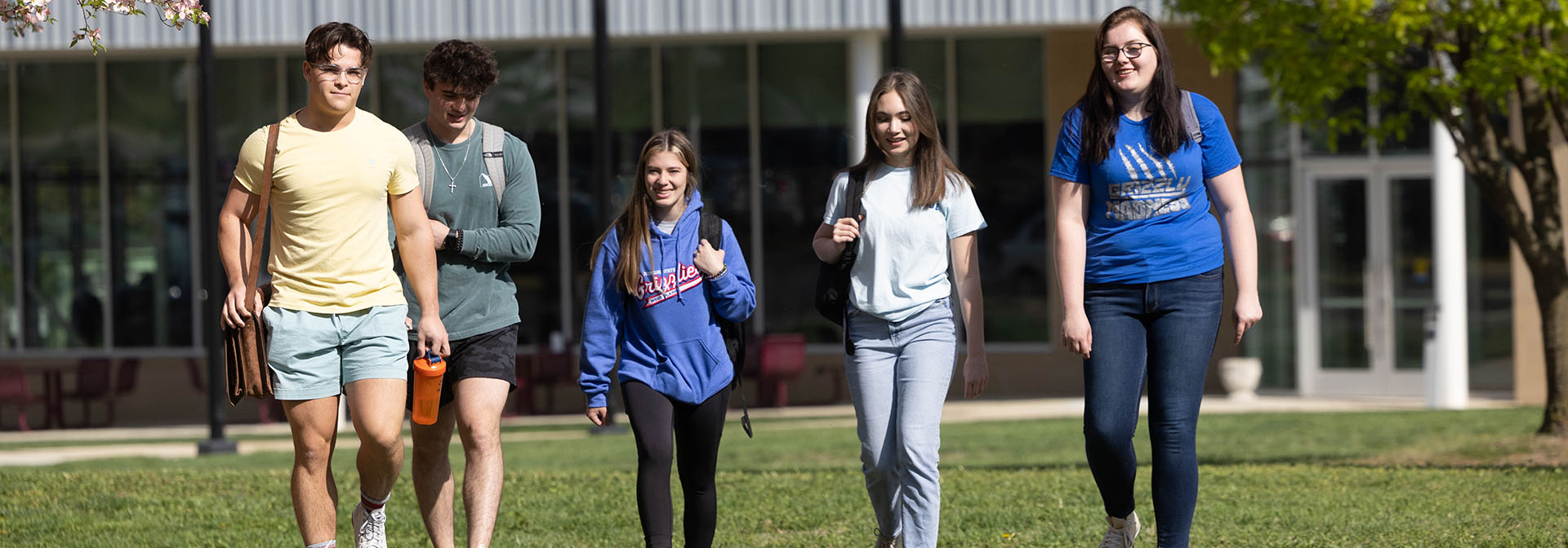 Students walking in front of Hass-Darr Hall in Spring