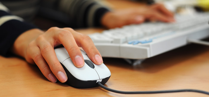 Woman using a computer mouse.