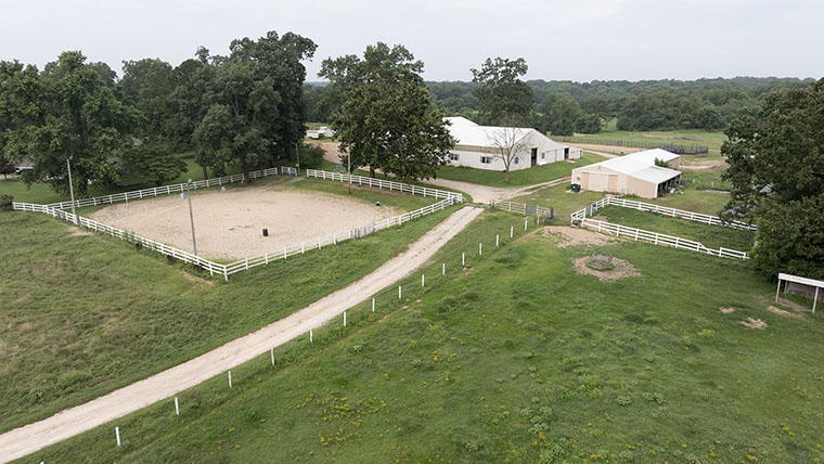 Bird's eye view of the entryway and two barn buildings