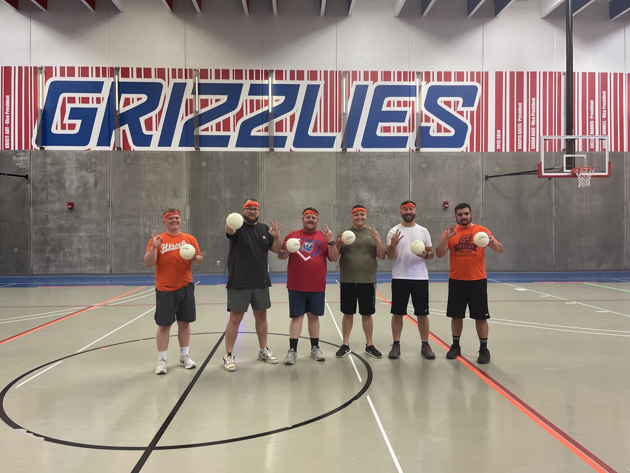 Intramural dodgeball team holding dodgeballs. 