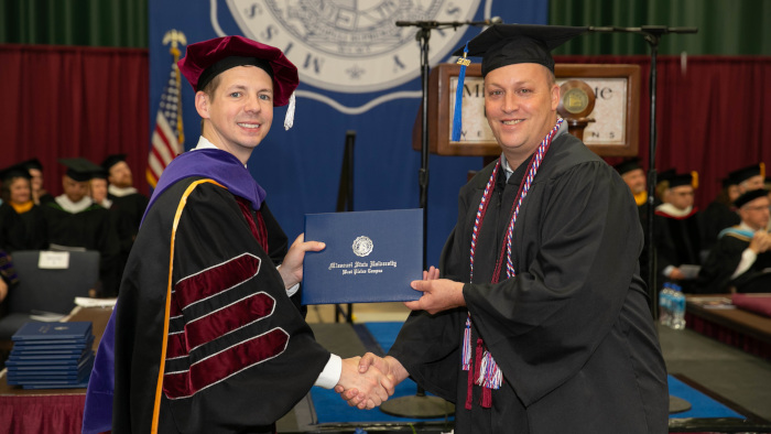 Receiving a diploma during Graduation