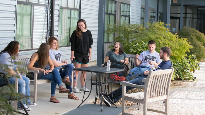 Students enjoying one of the courtyards at the Grizzly Lofts.