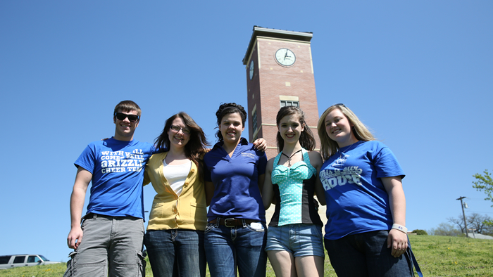 Students standing in front of the Smith-London Centennial Bell Tower