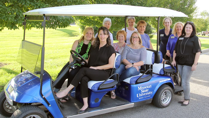 The Philanthropic Women for Education (PWE) recently donated funds for the purchase of this golf cart for the admissions office at Missouri State University-West Plains. The cart will be used for campus tours, among other uses, University officials said. Front row from left: PWE members Mary-Louise Tollenaar, Joyce McGee and Jessica Nease. Back row: PWE members Sandra Joplin, Elizabeth Grisham and Regina Gleghorn, Dean of Student Services Dr. Angela Totty, Coordinator of Admissions Melissa Jett and Recruitment Specialist Rachel Peterson. 
