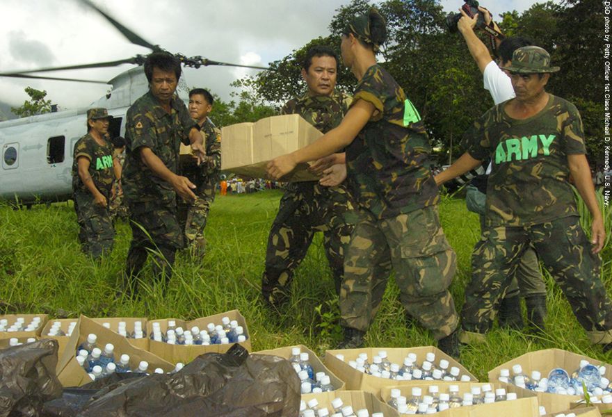 Military personnel helping those in need.