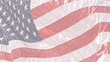 U.S. flag waving in the wind.