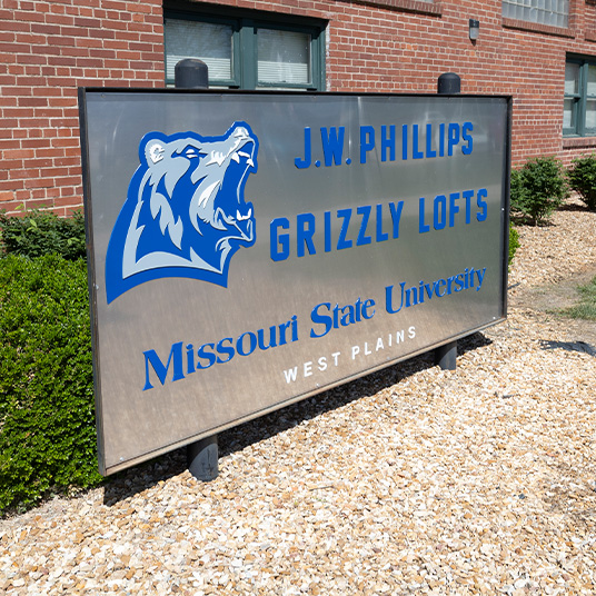 J.W. Phillips Grizzly Lofts sign in front of the building
