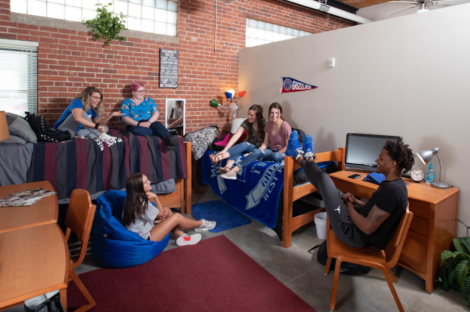 Group of students hanging out in a residence hall room