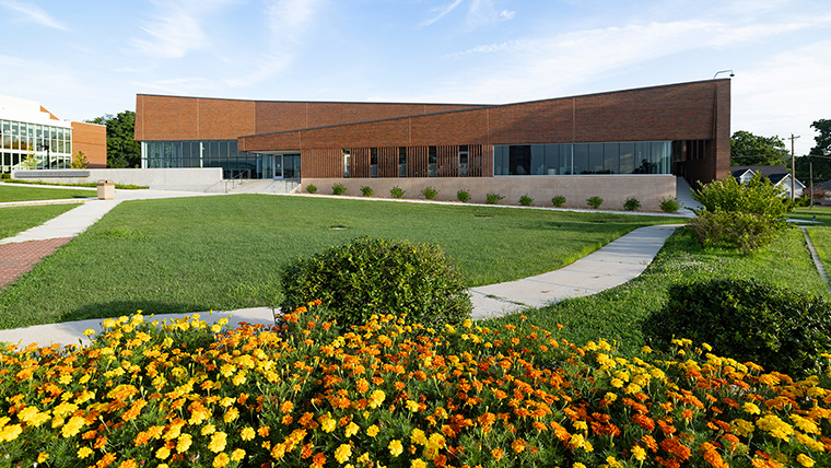 Neurodiversity building with flowers in front